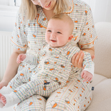 Baby wearing the ZIPSTER x Miffy Checkered Bloom bamboo babygrow