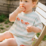 Maglietta oversize per bambini a righe con conchiglie color verde mare