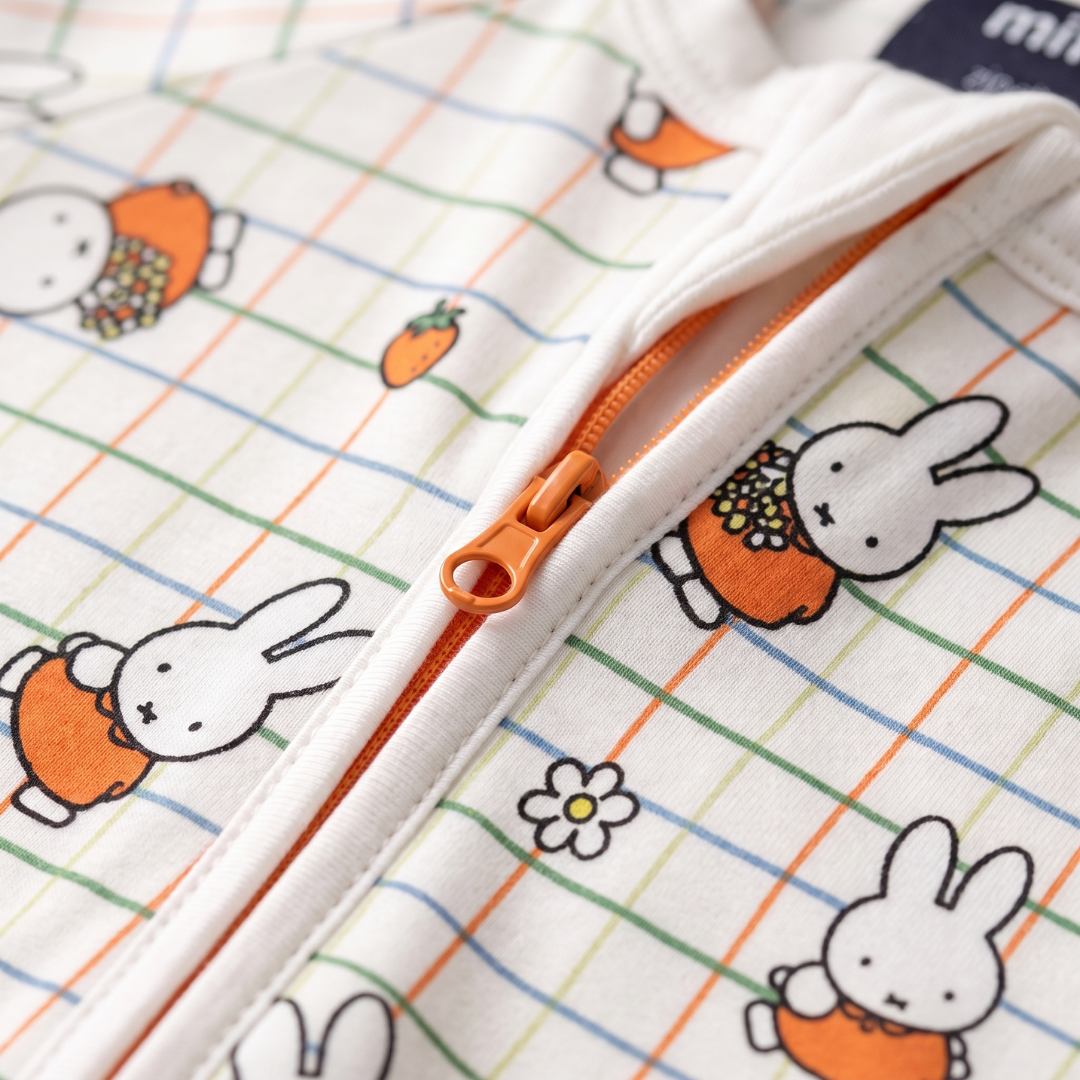 Two-way zip detail on the ZIPSTER x Miffy Checkered Bloom bamboo babygrow